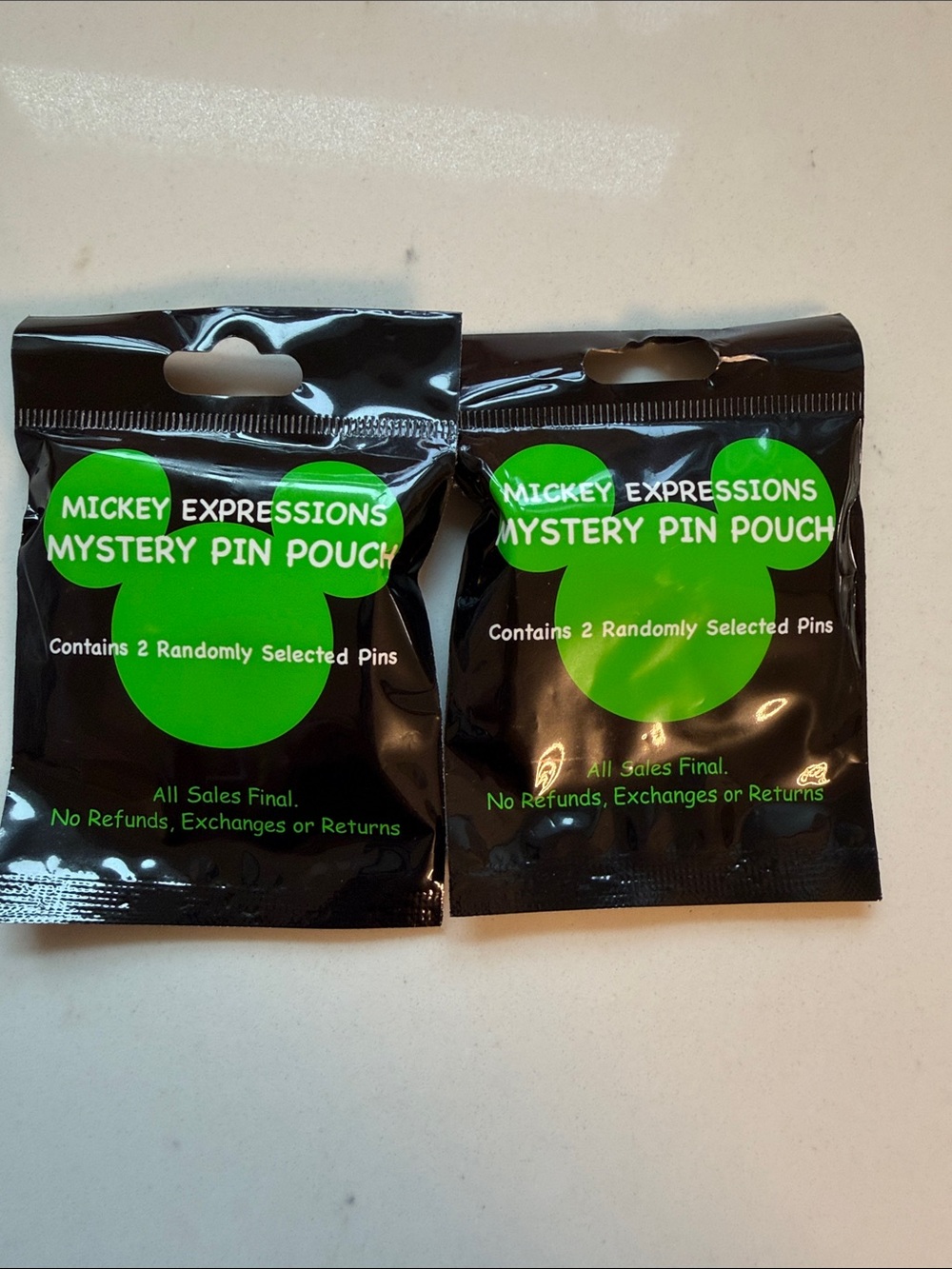 Expressions Mystery Pin Pouch - Black with Green Logo sealed 4 pins